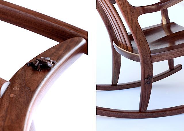 carved frog on a rocking chair back leg