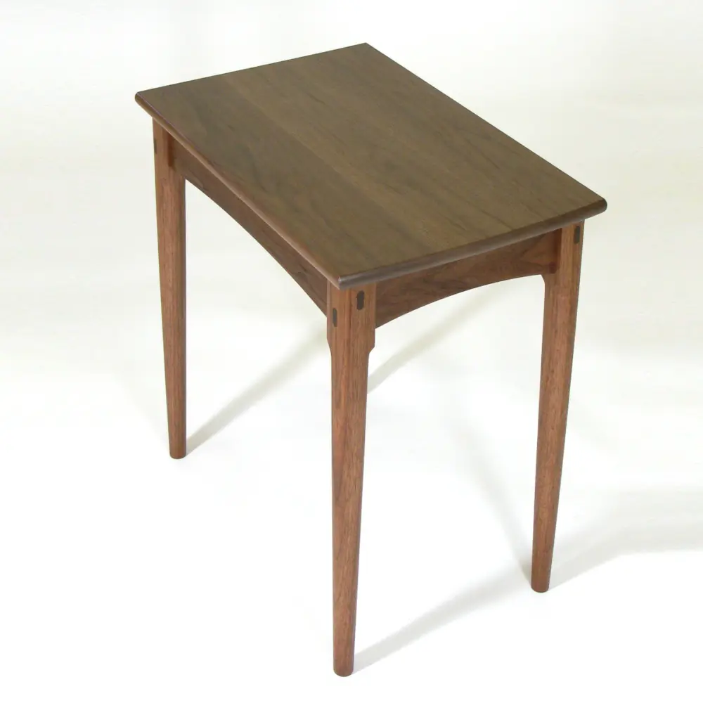 A walnut side table to support a book or beverage or such, a tender for a rocker.